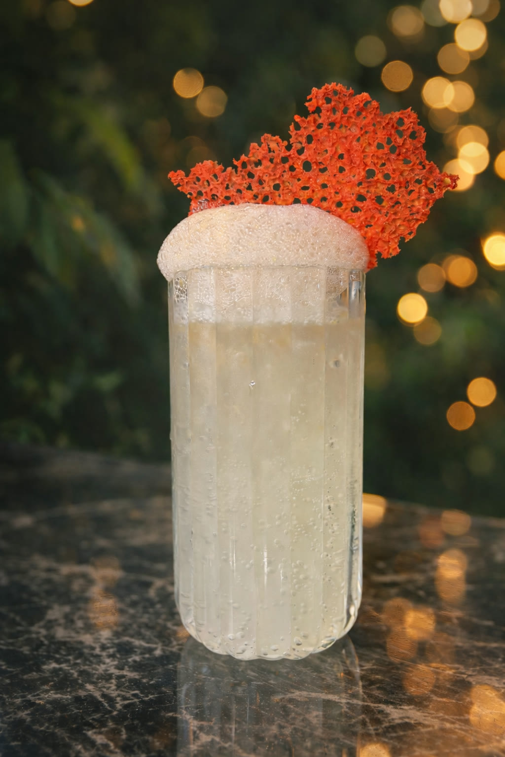 Paloma Ajena — cloudy highball with red coral garnish