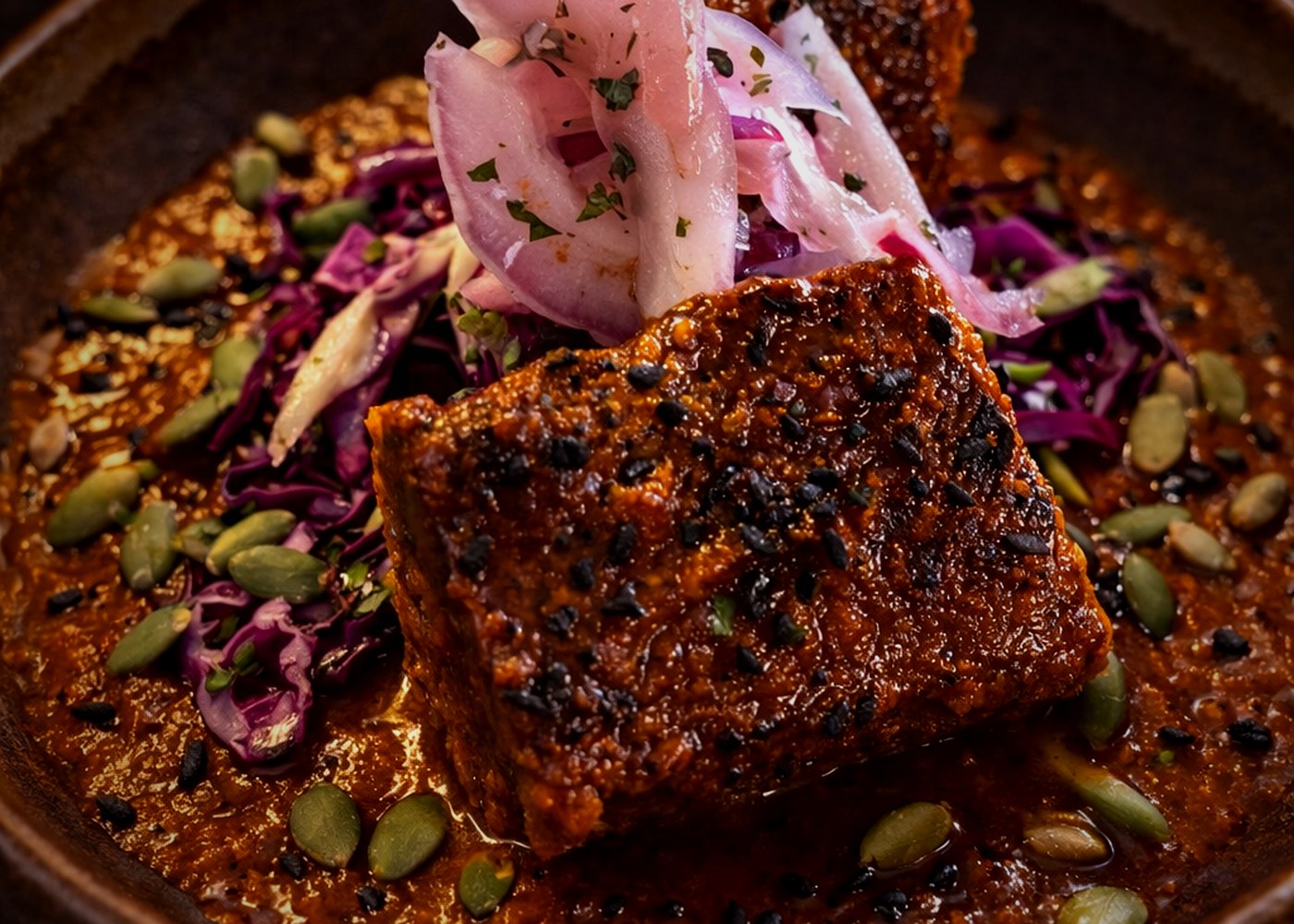 Pork belly close-up with dark mole reduction