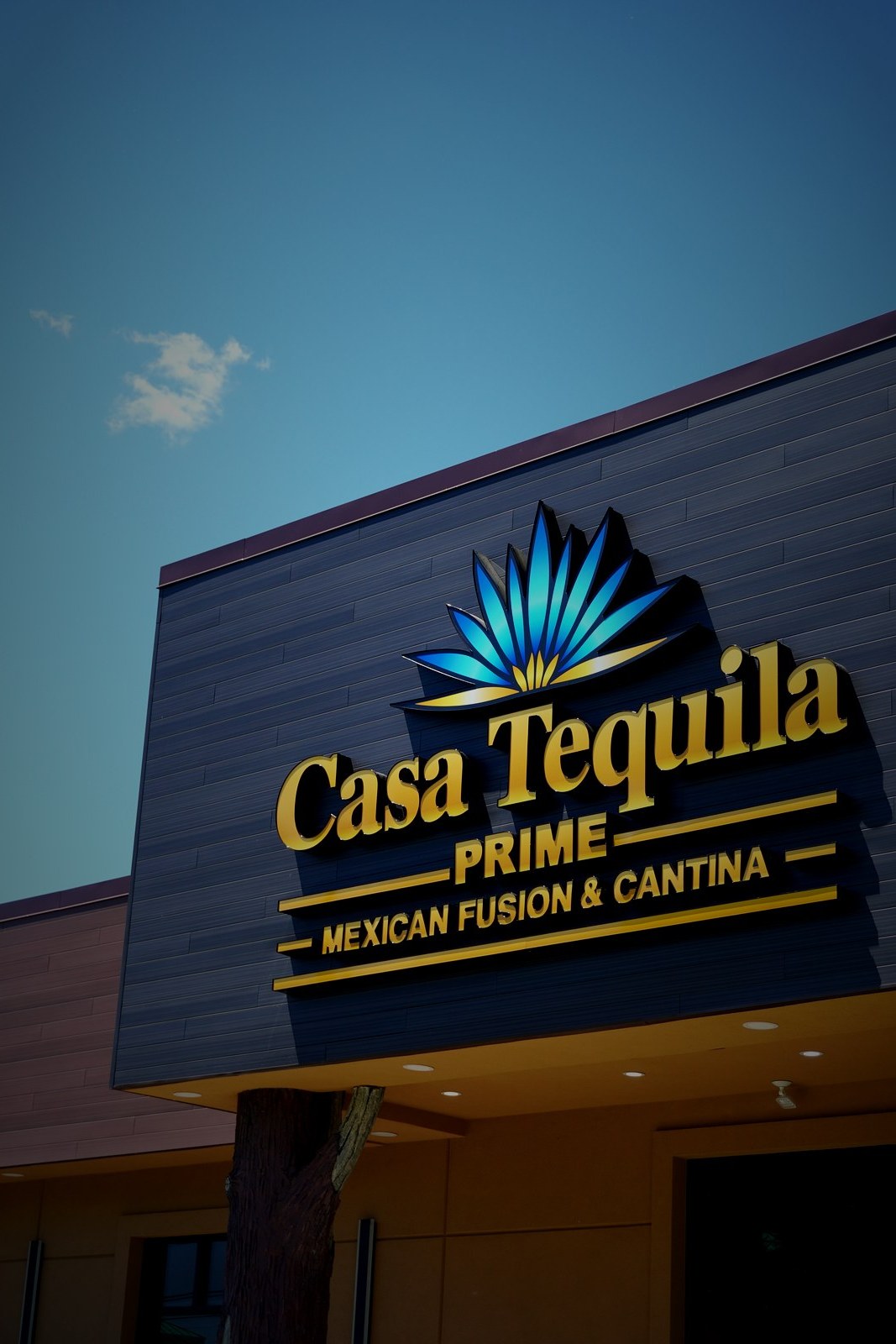 Casa Tequila Prime exterior sign against blue sky — Walled Lake Michigan